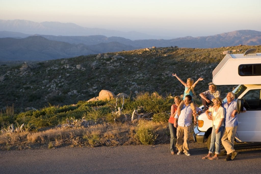 family stood outside of motor home