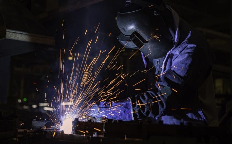 Industrial Worker at the factory welding closeup