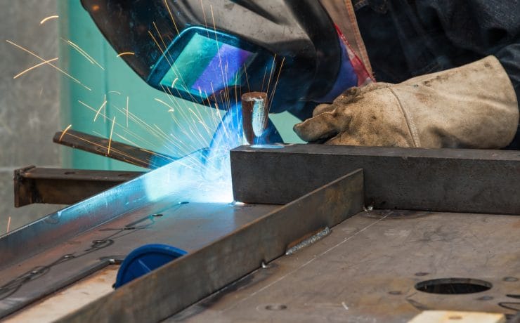 Person Welding Metal
