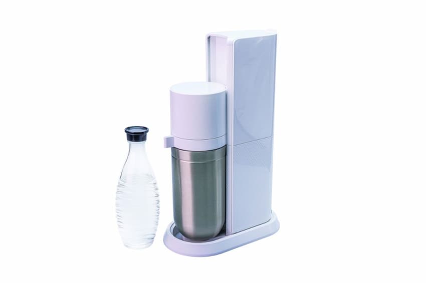 A water bottle next to a water filter