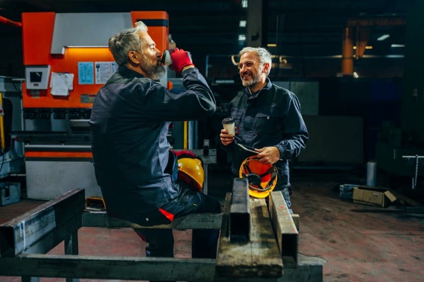 A couple of men in a factory