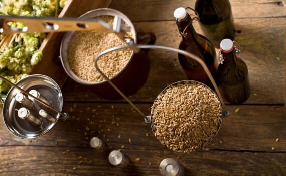 A weighing scale with a bucket of grain