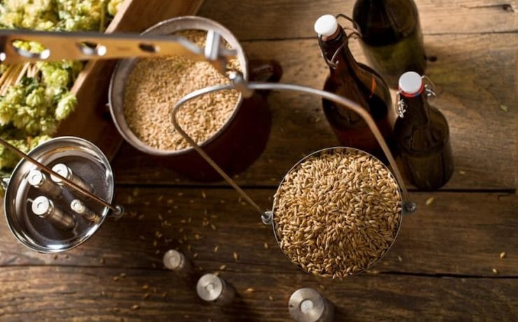 A weighing scale with a bucket of grain