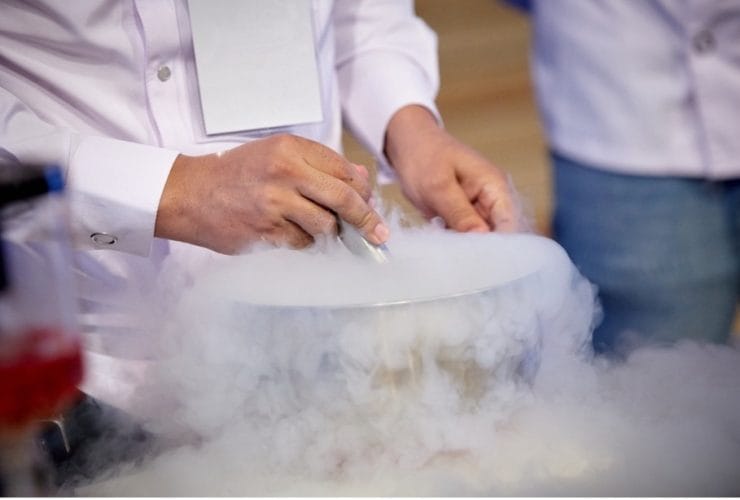 A person using a liquid in a bowl