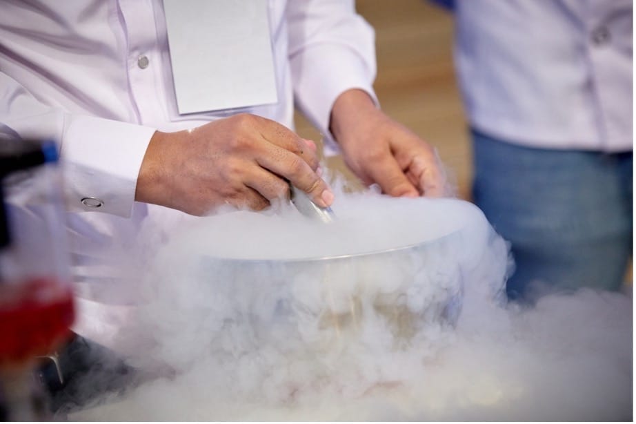 A person using a liquid in a bowl