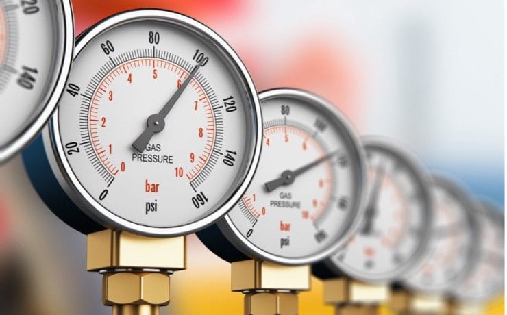 A close-up of a row of pressure gauges