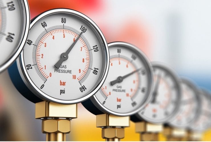 A close-up of a row of pressure gauges