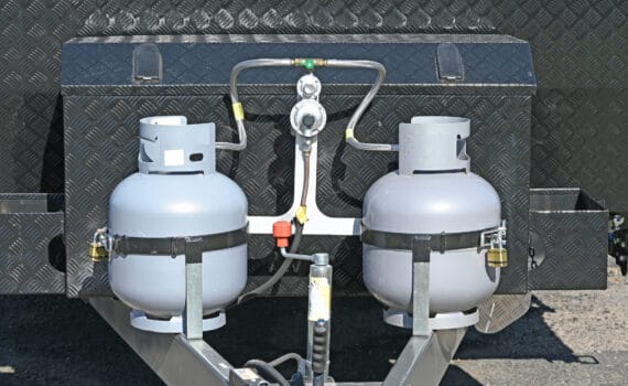 Two liquid petroleum gas bottles on the front of a caravan
